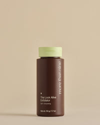 The Look Alive Exfoliator bottle on a neutral background