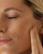 Person applying The Go-To Moisturizer to their cheek