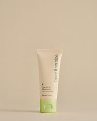 Travel-size The Go-To Moisturizer bottle on a neutral background